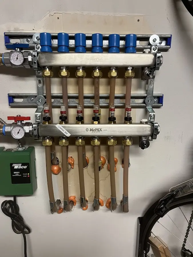 Plumber performing Water Heater Repair at a residential property in Tukwila